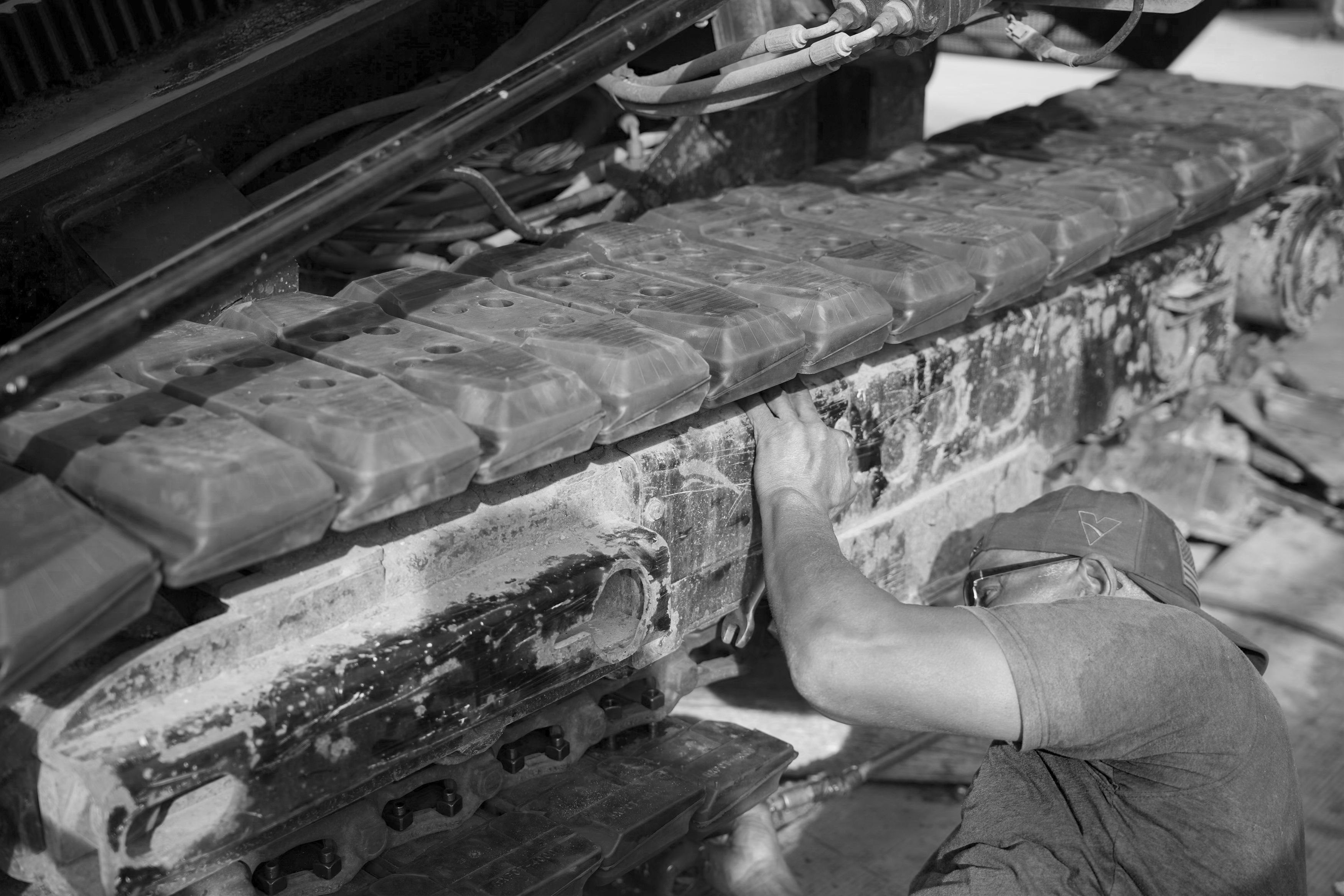 Technician working on a tracked machine